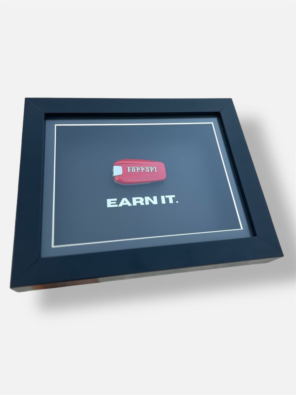 EARN IT. FERRARI